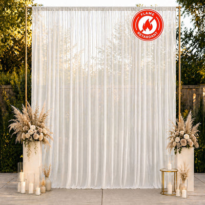 Elegant ivory wedding backdrop with candles and floral arrangements, flame retardant