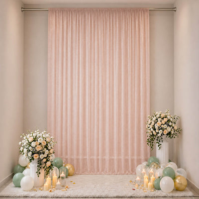 Elegant pastel baby shower backdrop with flowers, balloons, and candles