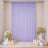 Elegant pastel lavender party backdrop with flowers, balloons, and candles