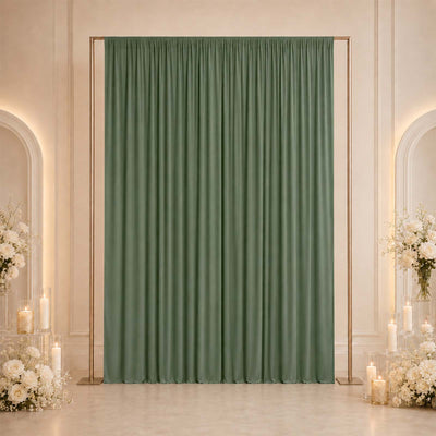 Elegant sage green curtain backdrop with gold frame and floral candle decor