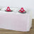 Shimmering pink table cover with elegant place settings and napkins.