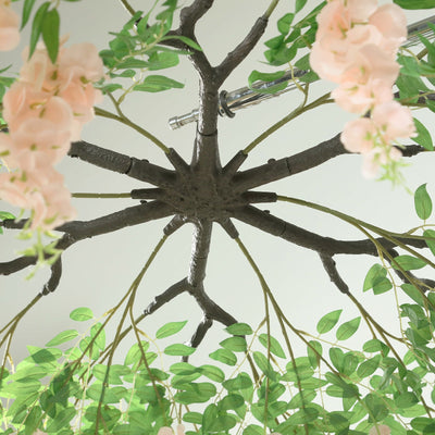 Artificial flower chandelier with branches and pink blossoms