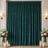 Elegant teal velvet curtains with candles, flowers, and wall sconces in a formal room