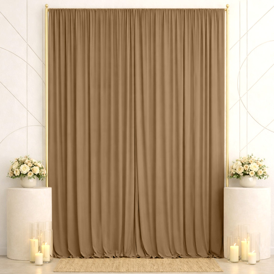 Elegant wedding backdrop with beige curtains, floral arrangements, and candles