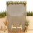 Elegant wedding ceremony backdrop with gold chairs, floral arch, and candles