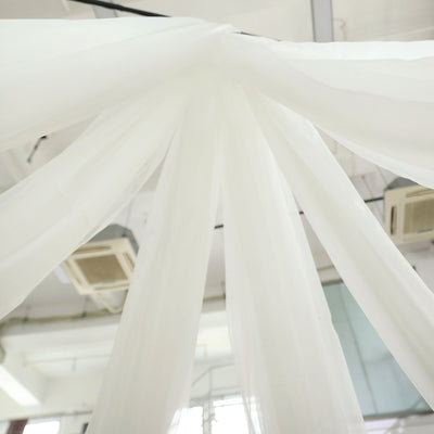 White sheer fabric draping elegantly from the ceiling
