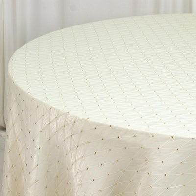 Elegant white textured tablecloth with gold dot pattern on round table