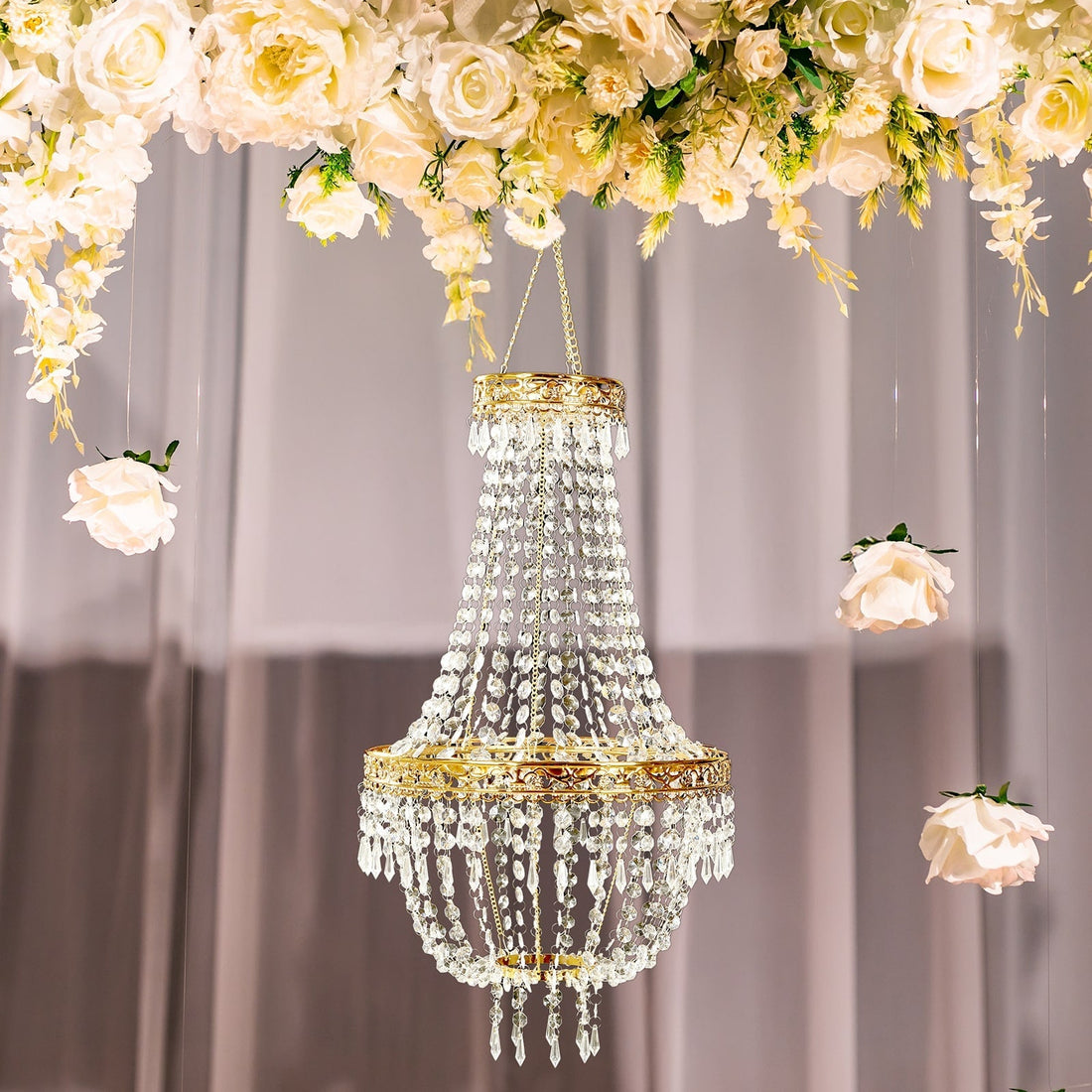Elegant crystal chandelier adorned with floral accents.