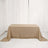Brown linen tablecloth draped over a table in a bright room.