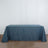 Blue tablecloth draped over a table in a studio setting.