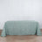 Light green tablecloth on a table against a plain backdrop