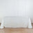 White tablecloth draped over a table in a studio setting
