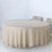 Round beige tablecloth draped elegantly over a table