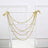 Gold pearl garland draped on a white chair with ribbons