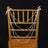 Crystal bead garland draped over a gold chiavari chair.
