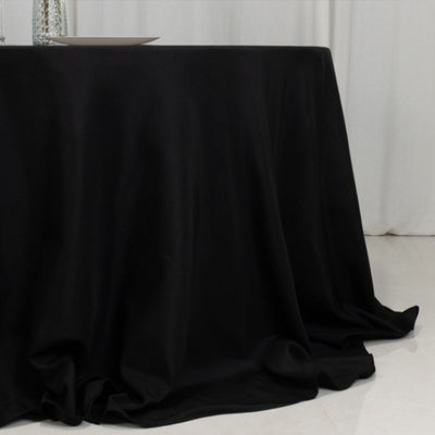 Black tablecloth draping elegantly over a table surface.
