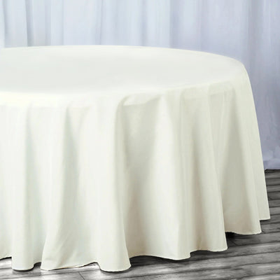 Round ivory tablecloth draped elegantly over a table