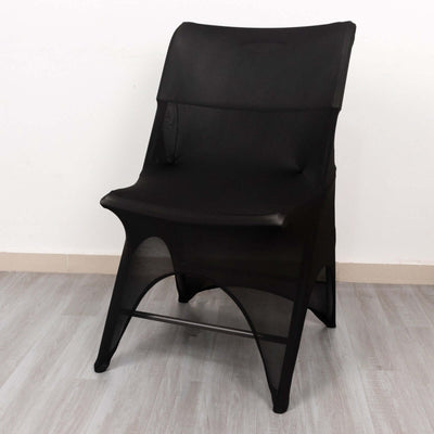 Black minimalist chair on a light wooden floor.
