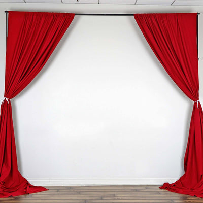 Red curtain backdrop draped elegantly on a white wall.