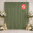 Flame retardant olive green curtain backdrop with white floral decor