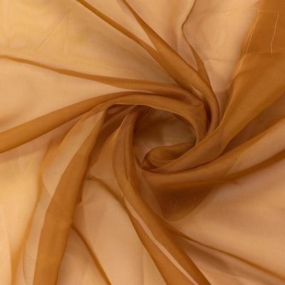 Sheer rust-colored fabric in a swirling pattern. #whtbkgd