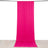 Pink fabric backdrop hanging in a studio setting for photography.
