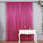 Shimmering pink sequin curtain draped elegantly on a stylish white table.