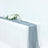 Elegant gray table runner draped over a white table with floral arrangements and glasses