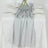Silver table runner on a white table with elegant glassware and floral decor.