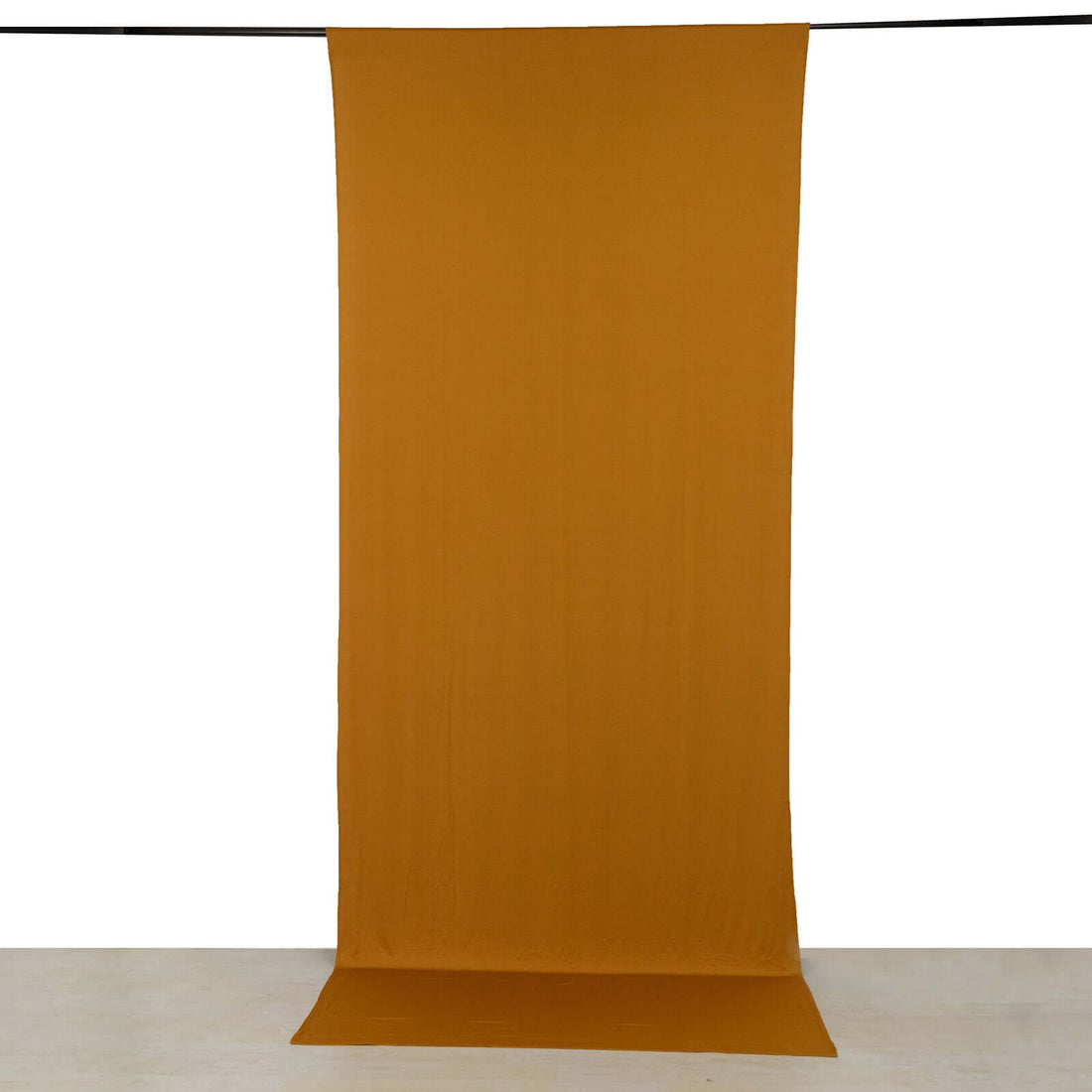 Solid mustard yellow fabric backdrop for photography