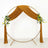 Brown draped wedding arch with floral accents on a white background