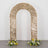 Gold sequin wedding backdrop arch with floral arrangements on the base.
