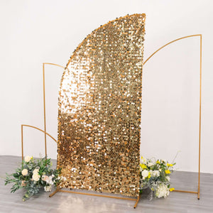 Gold sequin backdrop with floral arrangements on the sides