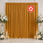 Gold flame retardant wedding curtain backdrop with white floral arrangements and candles