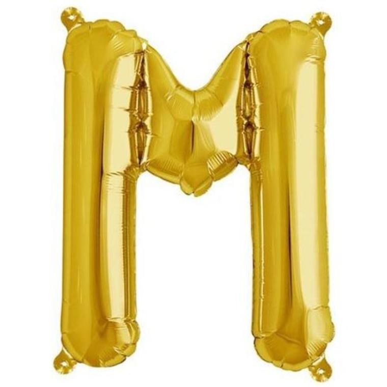 Gold foil balloon letter M on white background