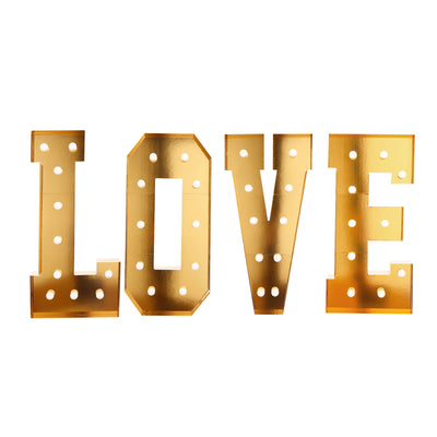 Gold marquee letters spelling LOVE with light bulb holes on white background#whtbkgd
