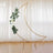 Gold crescent moon backdrop with white roses and greenery