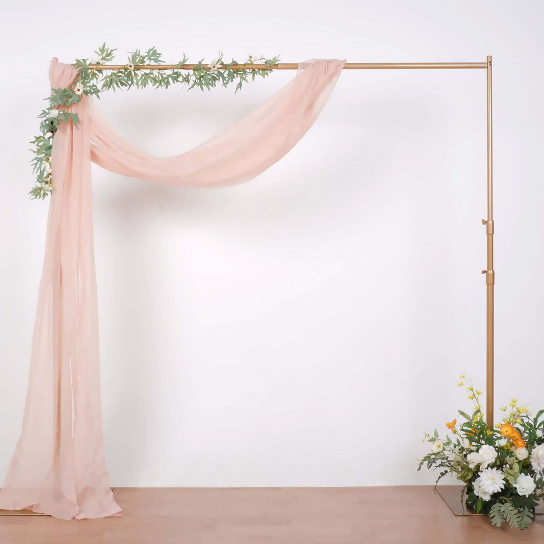 Elegant wedding arch with draped fabric and floral arrangement