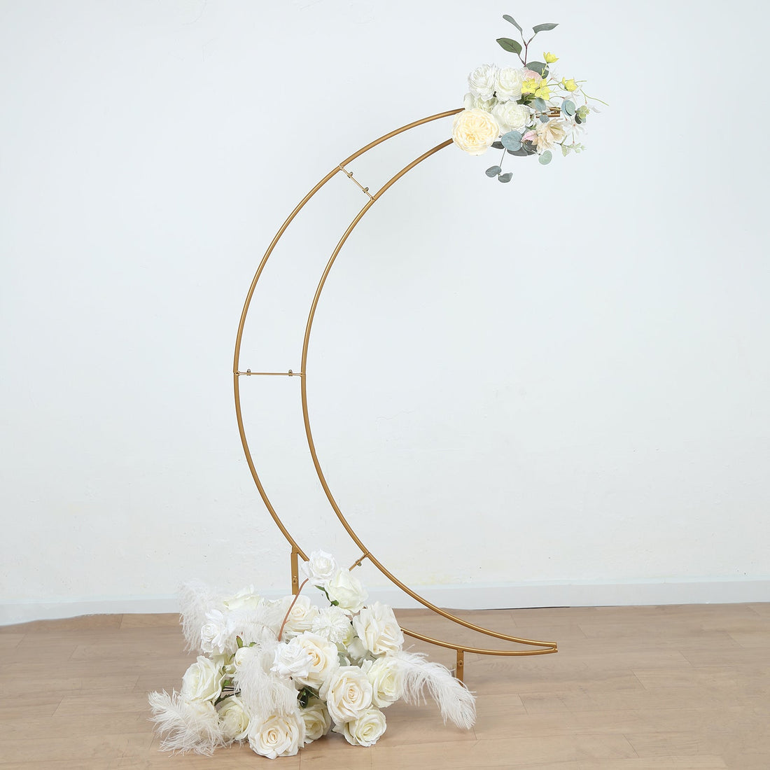 Gold crescent moon floral arch with white roses and greenery