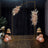 Elegant floral backdrop with balloons and dessert tables for events.