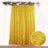 Gold shimmer curtain with decorative floral top.