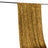 Gold velvet fabric draped on a rod, showcasing its rich texture and color.