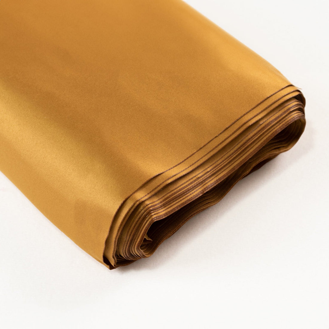Folded gold satin fabric