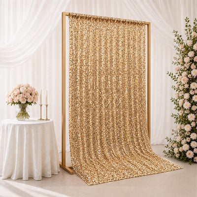 Gold sequin wedding backdrop with floral decor and white table