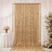 Gold sequin wedding backdrop with white floral decor and draped curtains
