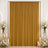 Gold velvet backdrop curtain with white floral arrangements and candles for wedding decor