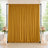 Gold wedding backdrop curtain with floral arrangements and candles