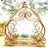 Gold decorative carriage stand with macaron display.