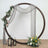 Decorative wedding arch with draped fabric and floral arrangements.