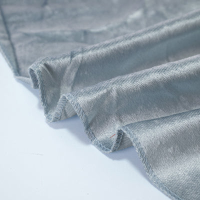 Gray velour fabric with folded edges and soft texture close-up